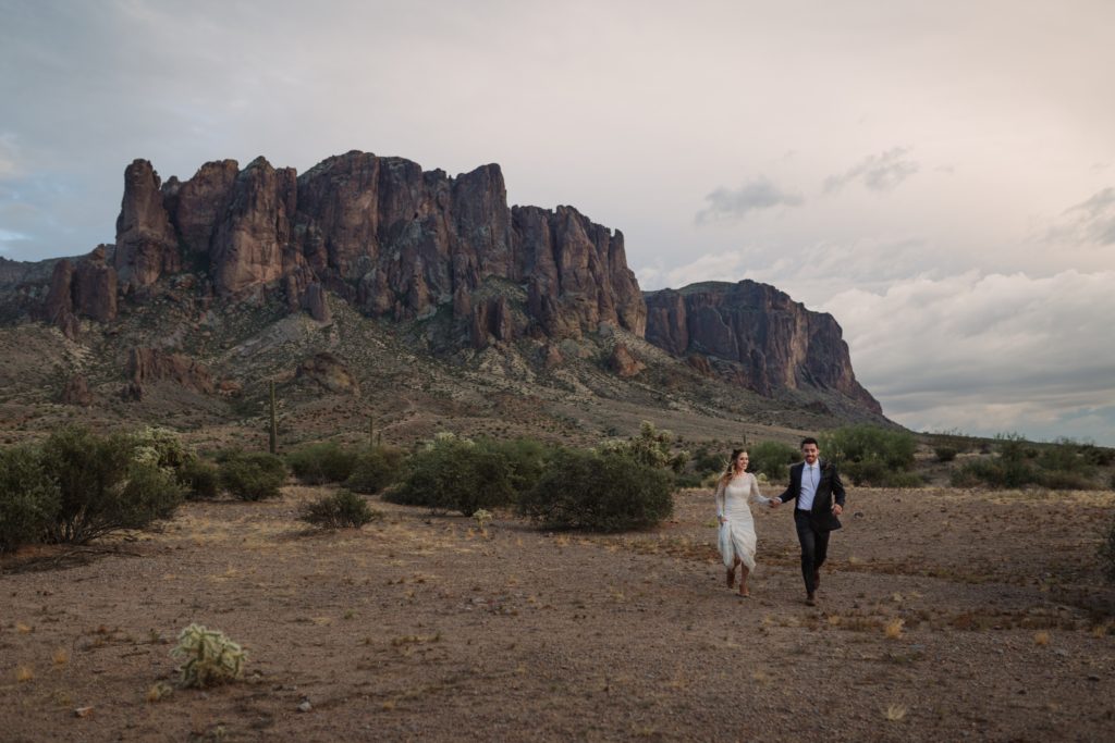 Superstition Mountains Desert Elopement with Couple Running