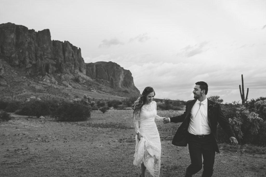Superstition Mountains Desert Elopement Couple Running Photo