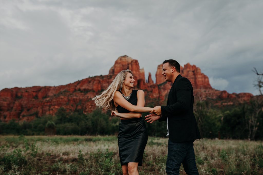 Dancing Red Rock Crossing Engagement Photos monsoon Arizona Sedona Suzy Goodrick Photography