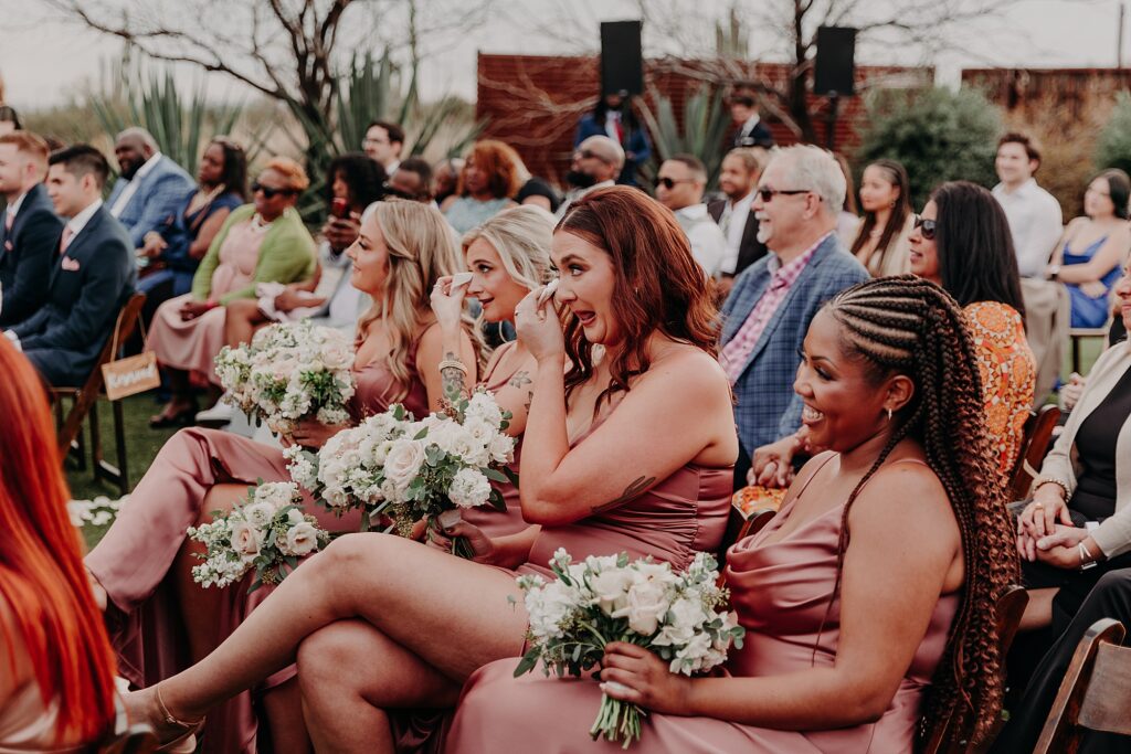 bridesmaids cry during wedding ceremony