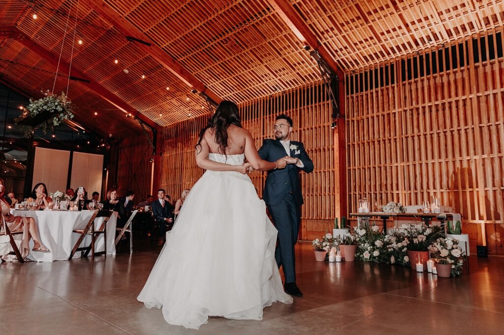 bride and groom share their first dance at wedding reception