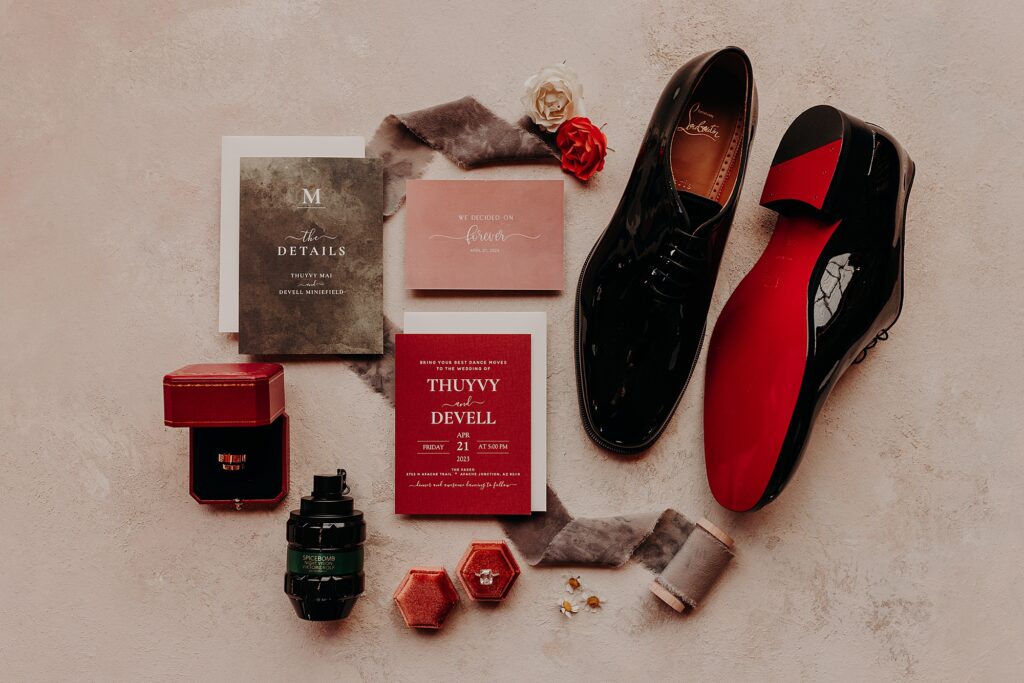 louboutin dress shoes styled with wedding invitation and accessories