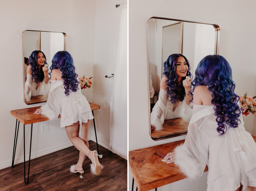 bride looks in the mirror and puts on lipstick for wedding day