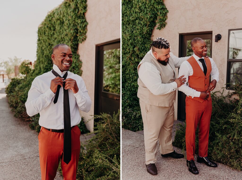 best man helps groom put on wedding suit