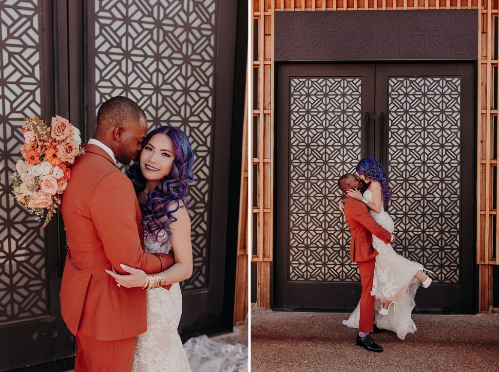 groom picks up bride against mosaic designed door