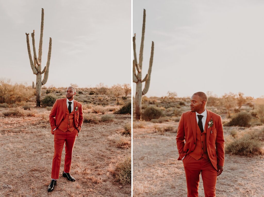 groom poses for the camera in terracotta suit in the desert
