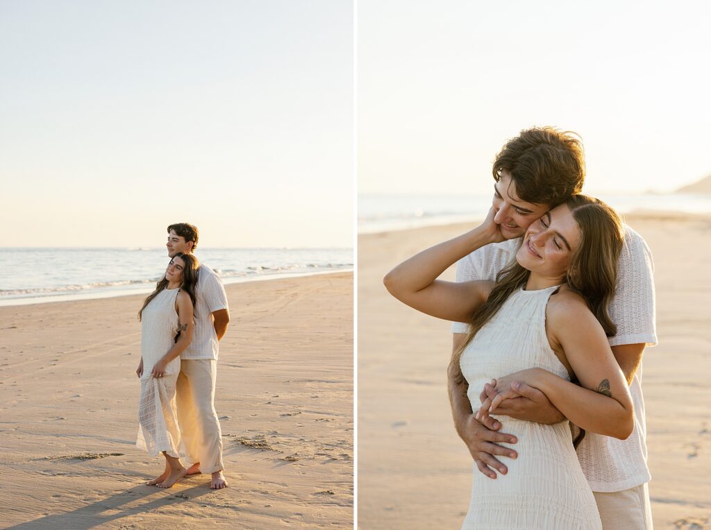 couple romantically cuddle and watch the sunset on a beach in rocky point