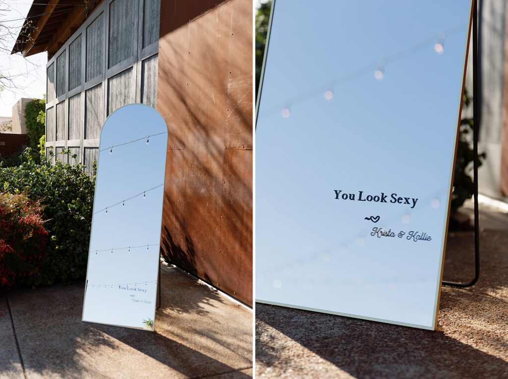 Custom mirror at wedding reception with monogram.