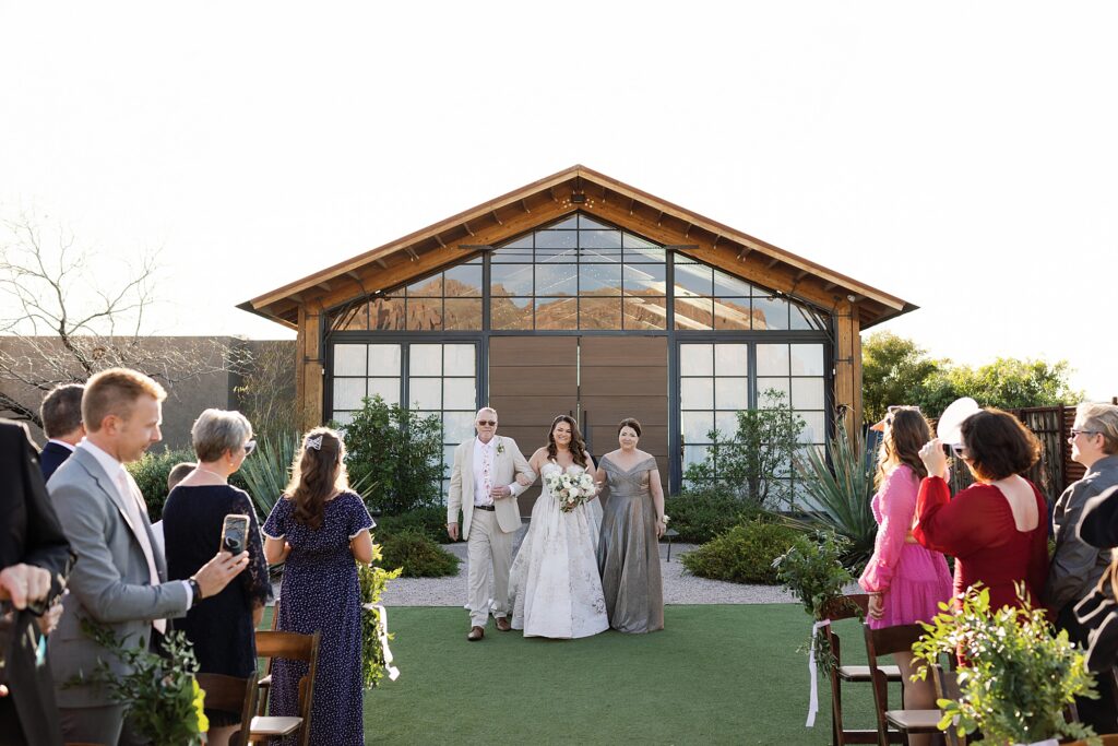 Bride walks down the aisle at the paseo wedding venue.
