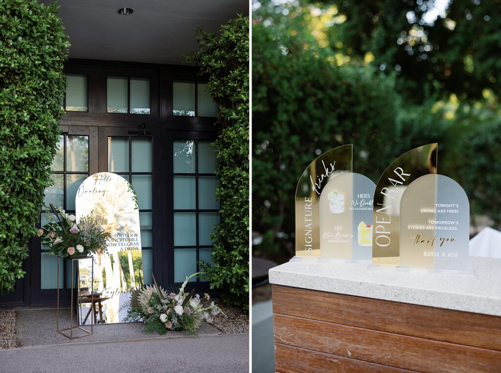 Custom gold bar menu and selfie mirror with decal and florals at wedding cocktail hour.