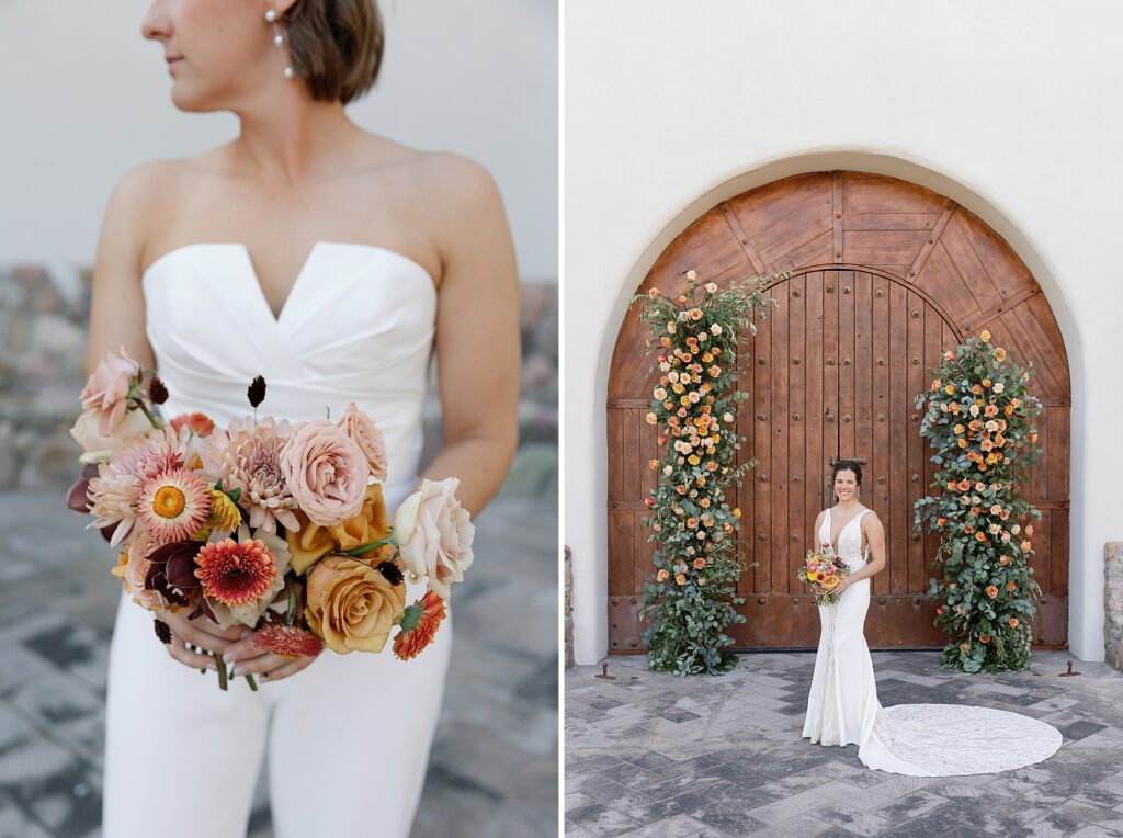 Bride looks over shoulder holding colorful bouquet in front of floral archway.