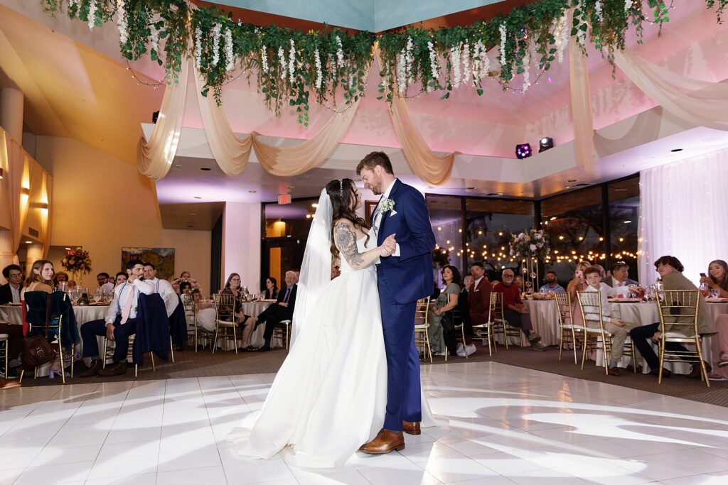 bride and groom share first dance at la mariposa in tucson arizona