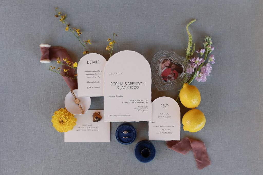wedding invitation suite styled with lemons and flowers