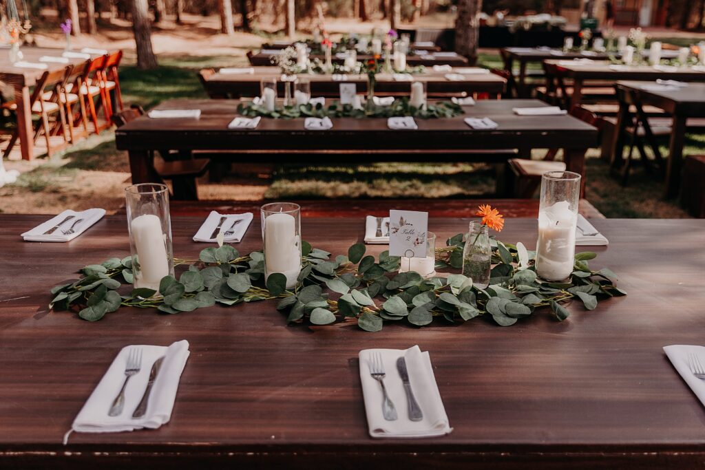 Wedding Reception of farm tables in a meadow