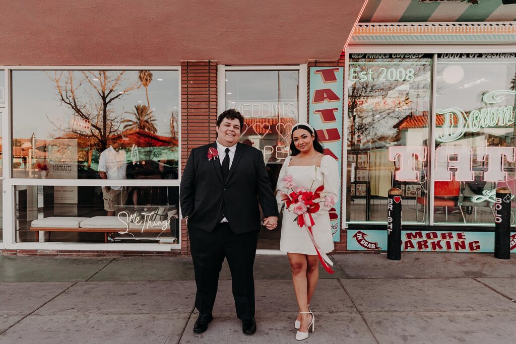 bride and groom stand outside sure thing wedding chapel in vegas